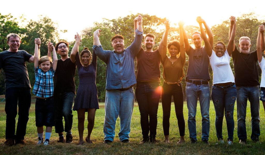 Cheerful People Holding Hands in Unity